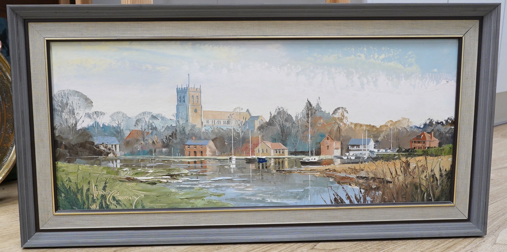 Harley Crossley (b.1936), impasto oil on board, Riverscape with church, signed, 29 x 69cm. Condition - good